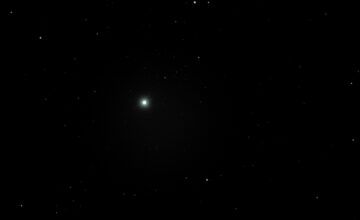 A photo of Polaris, the North Star, appearing bright in a black sky